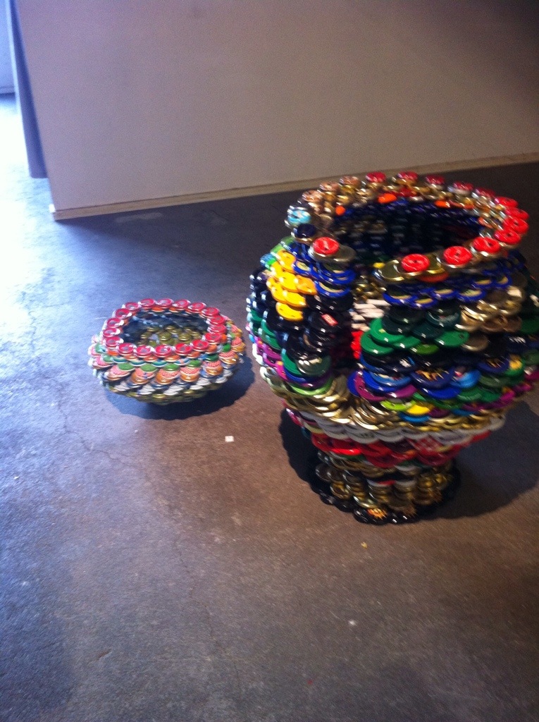 Sculpture made of metal lids-- Purhonen and Korhonen